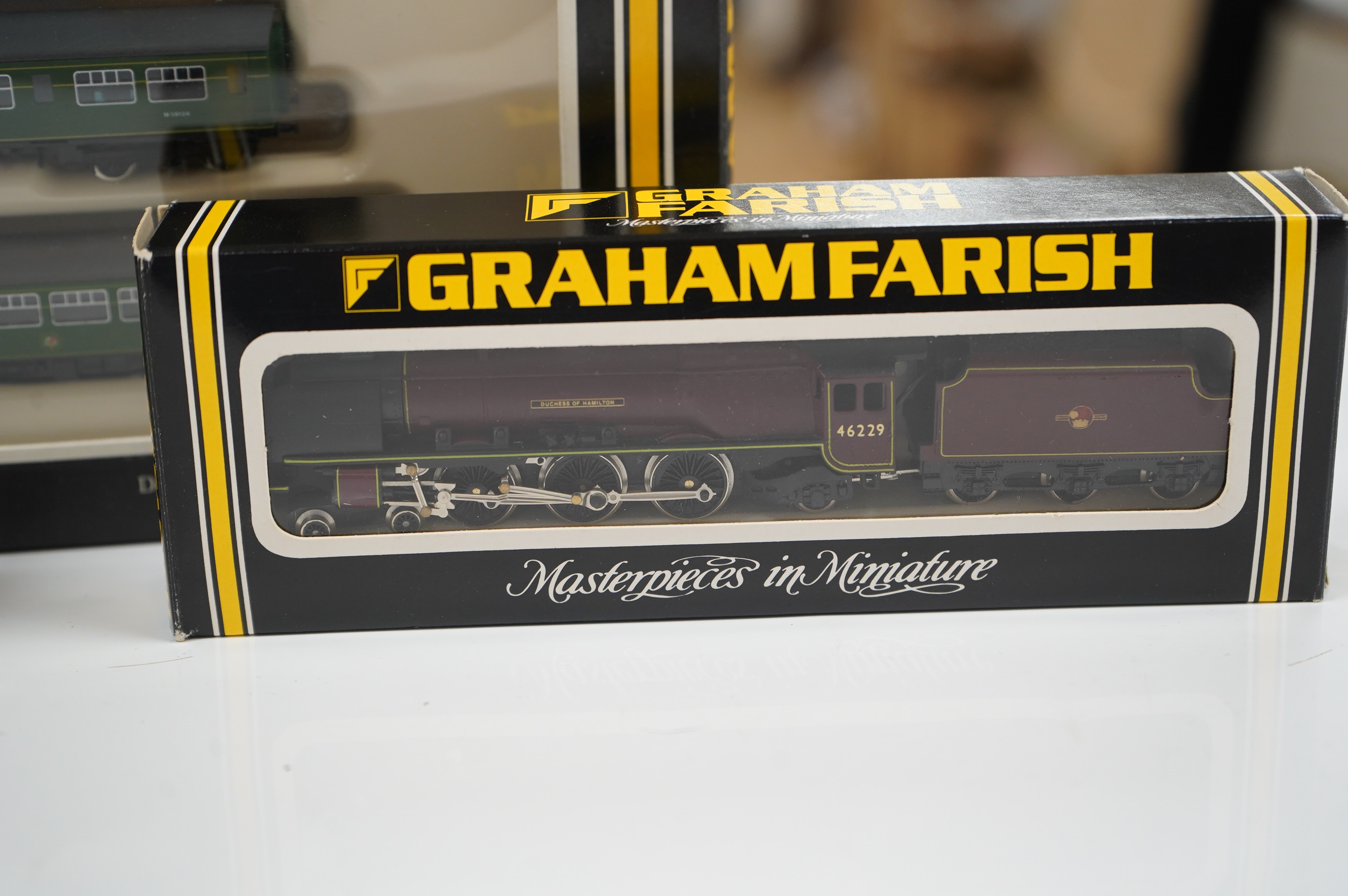 Three boxed Graham Farish N gauge railway BR locomotives; a Coronation Class 4-6-2 (1816), a Class 4MT 2-6-4T (1655), and a 3-car DMU (8143). Condition - good.